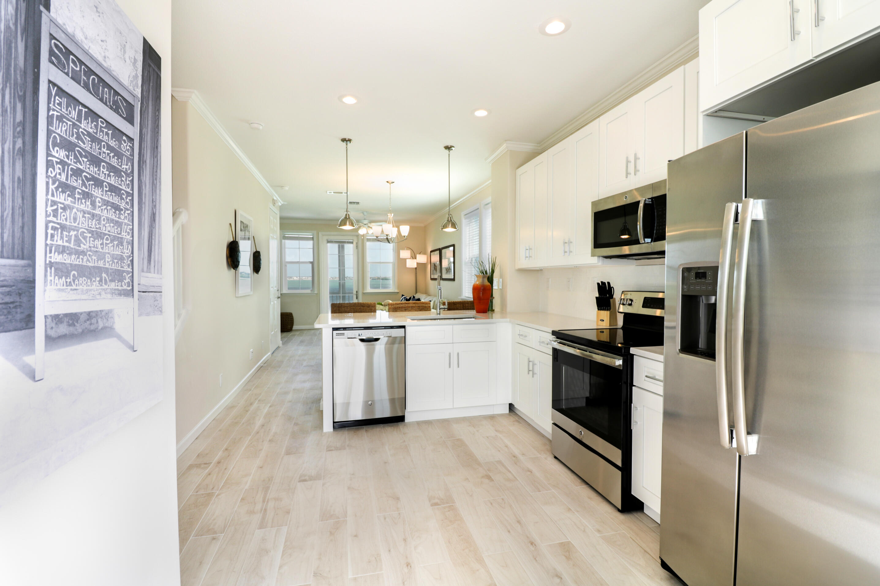 28515 Channel View Drive Summerland Key, FL 33042 - Photo 5 of 13 a kitchen with cabinets and stainless steel appliances