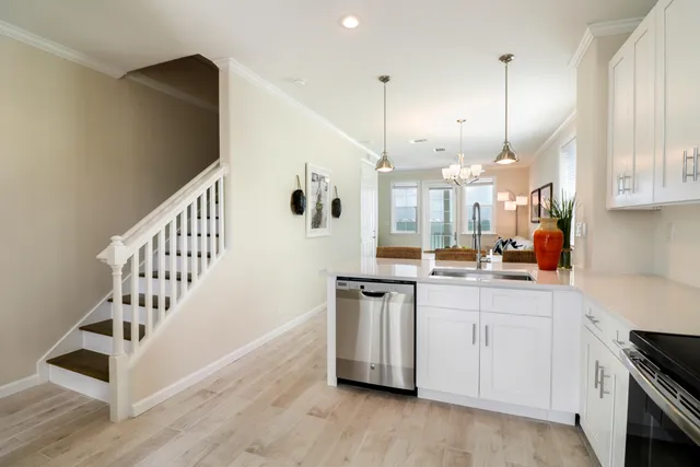 a kitchen with stainless steel appliances a refrigerator and a sink