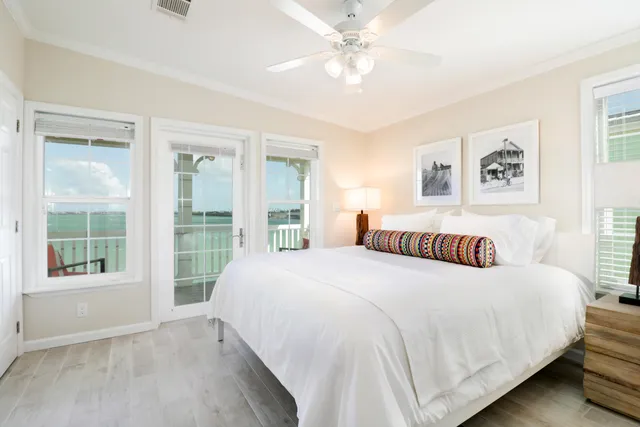 a bedroom with a large bed and a window