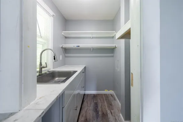 a kitchen with a sink and a window