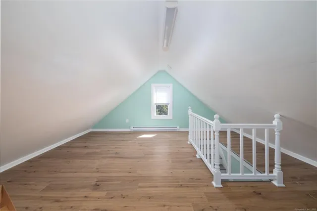 a view of entryway with wooden floor
