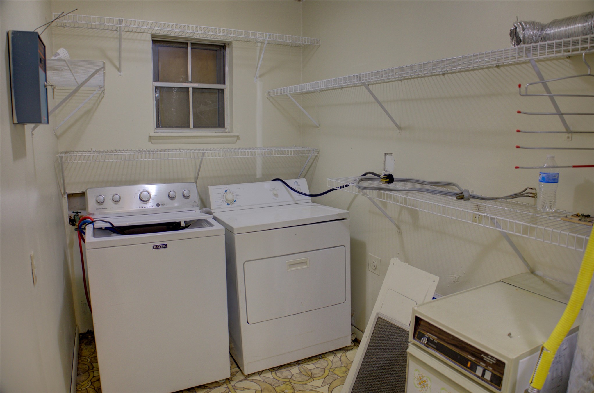 12420 South Garnett Road Broken Arrow, OK 74011 - Photo 27 of 44 White wire shelving, light-colored walls, and a single window