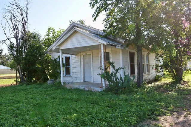a room with a stove a refrigerator and a sink