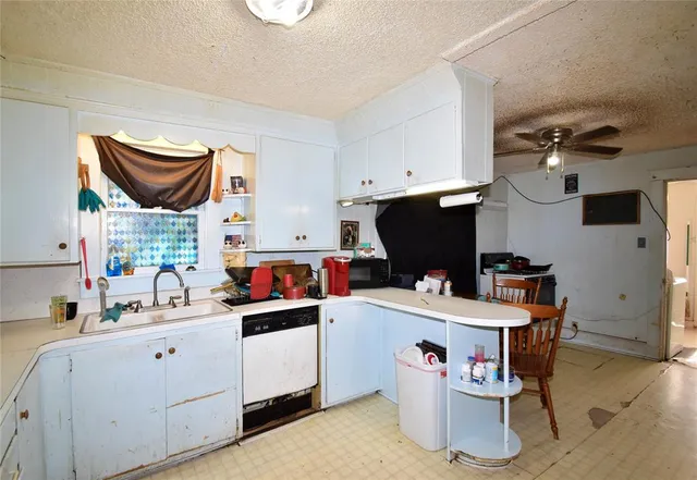 a kitchen that has a sink and a stove