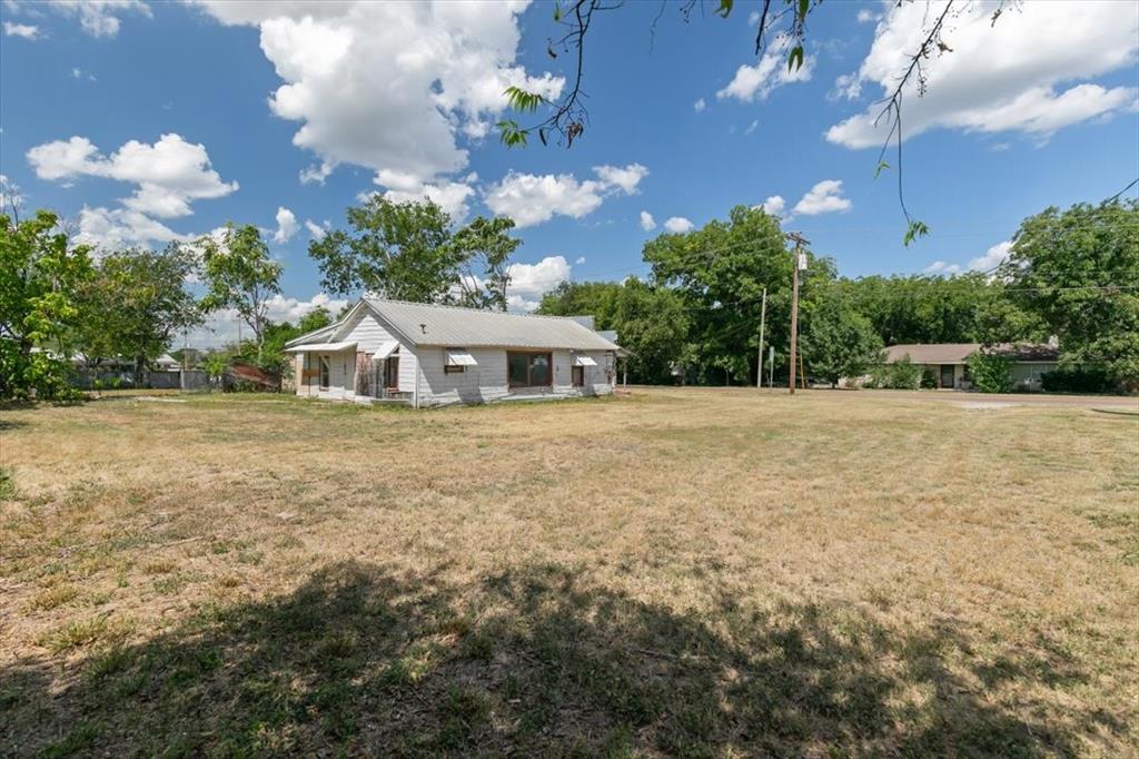 304 South Colorado Street Whitney, TX 76692 - Photo 23 of 32 a front view of a house with garden