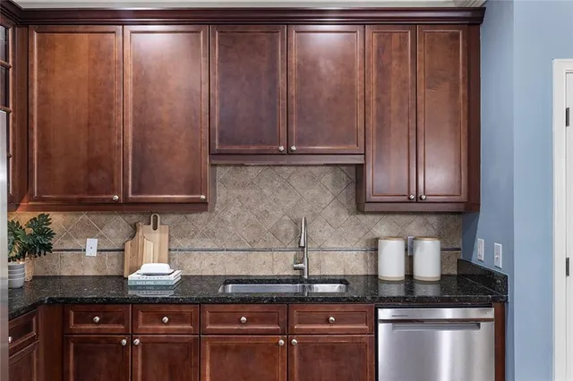 a kitchen with a table chairs stove and refrigerator