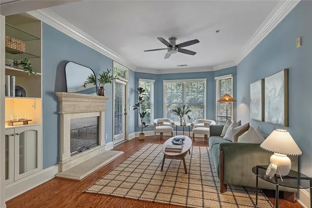 a living room with furniture and a fireplace