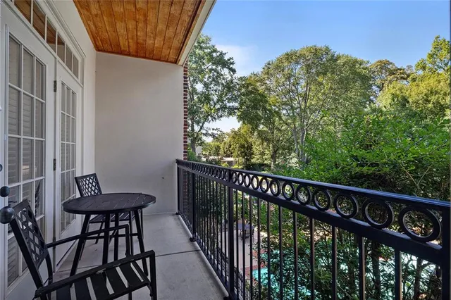 a view of a chair and table in the balcony