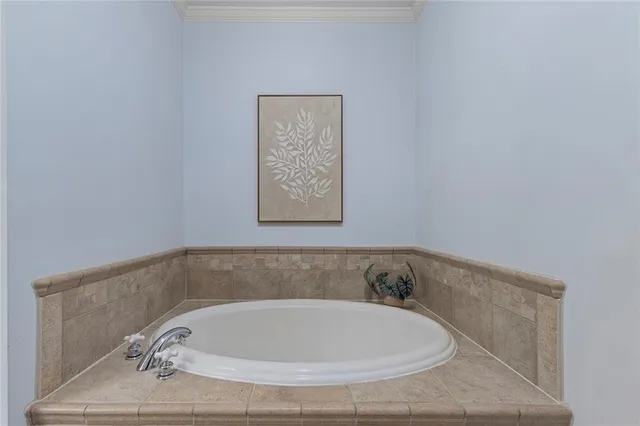 a en suite bathroom with a shower a sink and a mirror