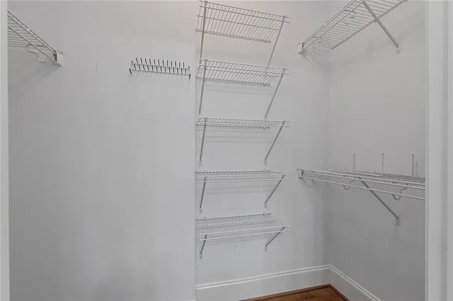 a bathroom with a sink a toilet a mirror and shower curtain