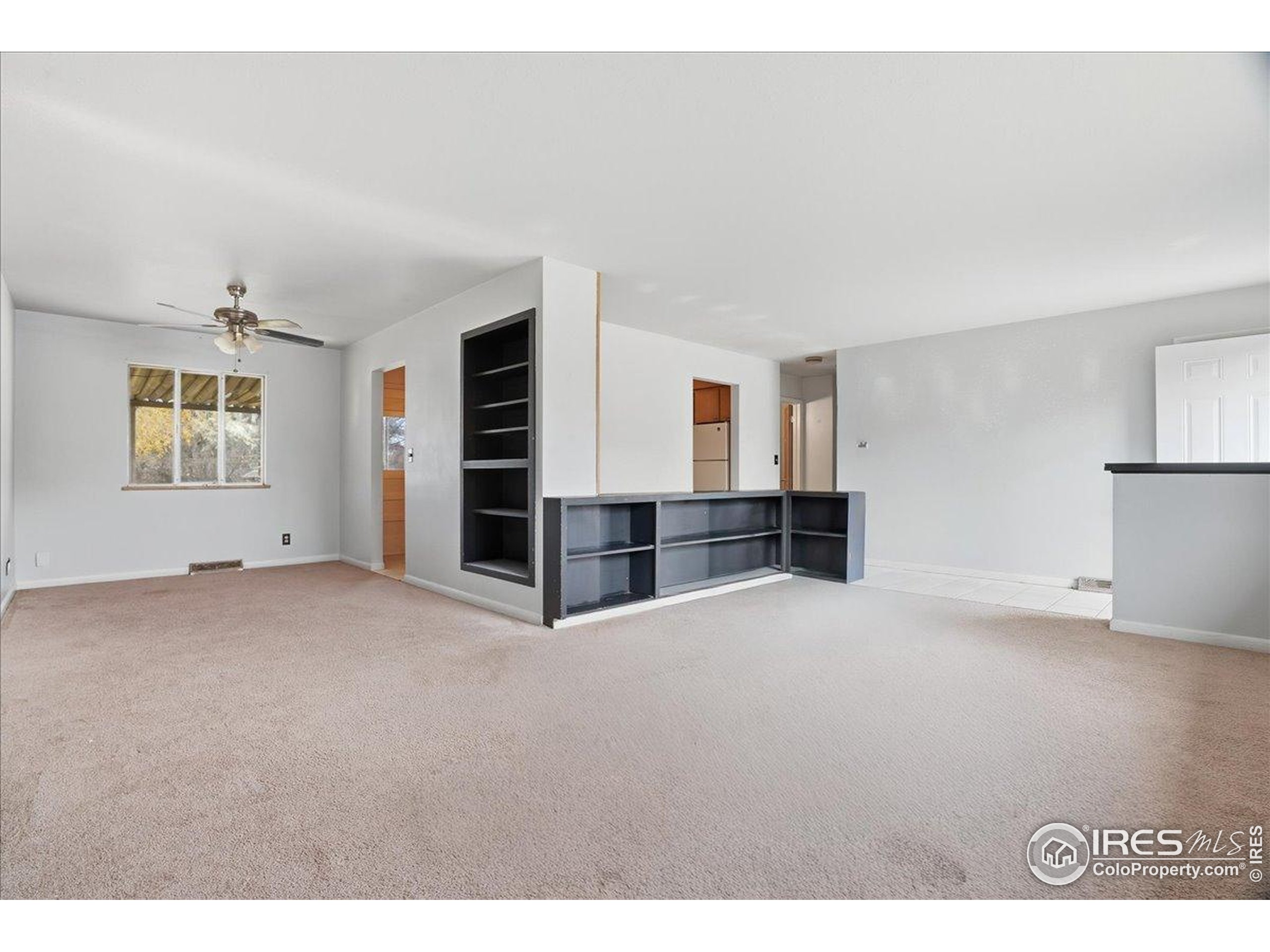 a view of an empty room with a window