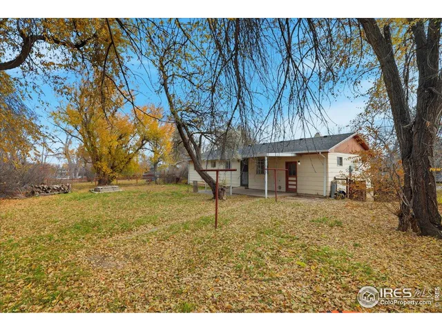a house is sitting in middle of forest