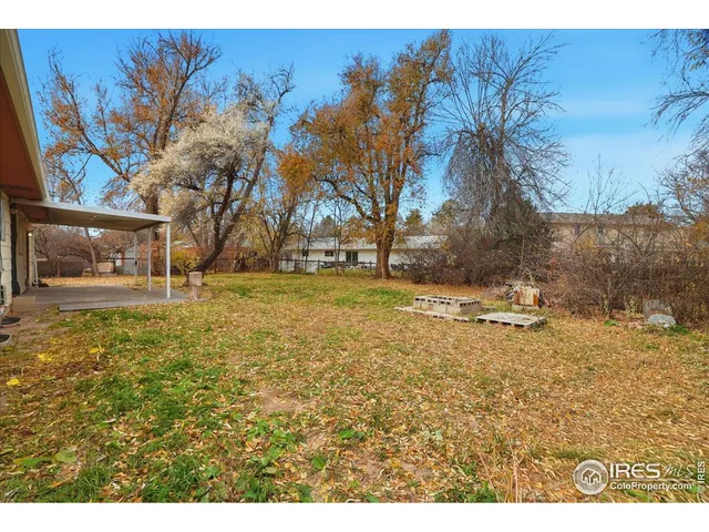 a view of swimming pool with a yard