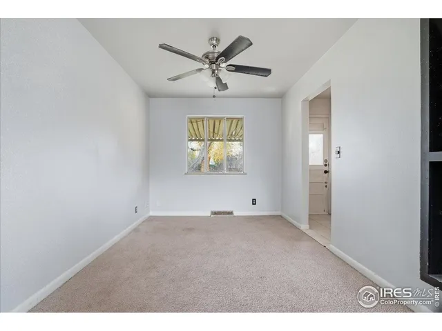 a view of an empty room and window
