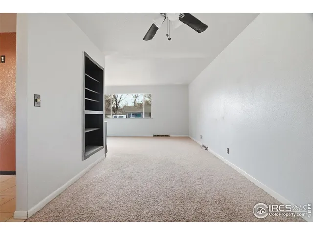a view of empty room with closet
