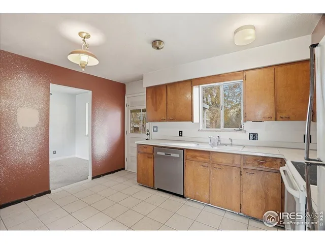 a large bathroom with a sink a mirror and a bathtub