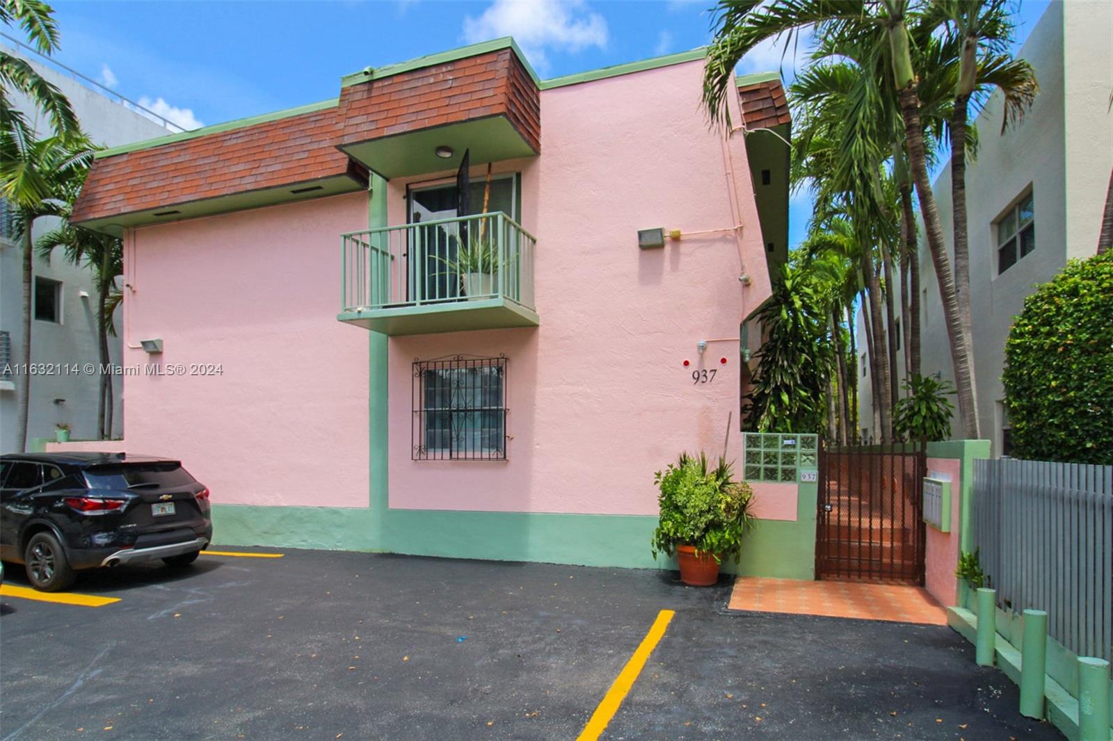 937 Michigan Avenue, Unit 4 Miami Beach, FL 33139 - Photo 1 of 20 a front view of a house with garage