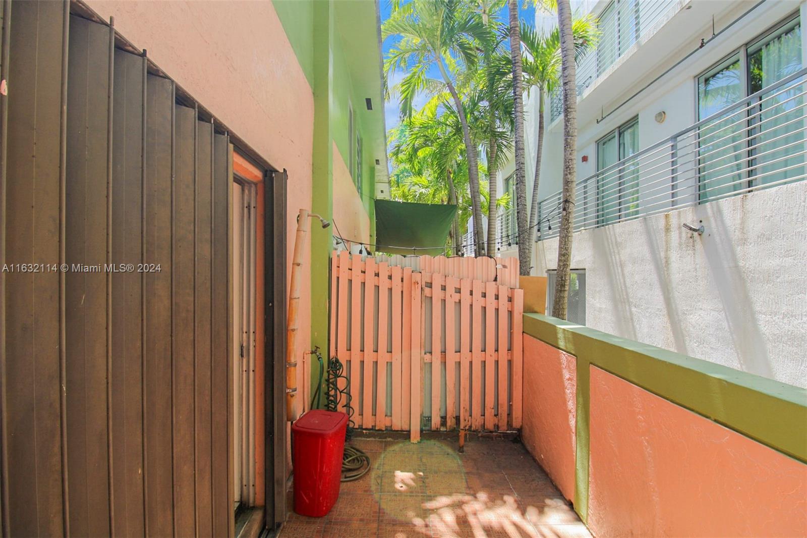 937 Michigan Avenue, Unit 4 Miami Beach, FL 33139 - Photo 13 of 20 a view of a balcony with chair and table