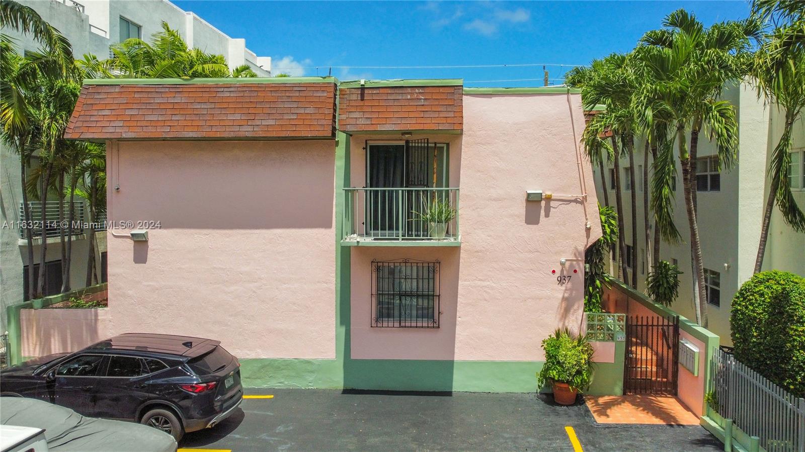 937 Michigan Avenue, Unit 4 Miami Beach, FL 33139 - Photo 15 of 20 a car parked in front of a house