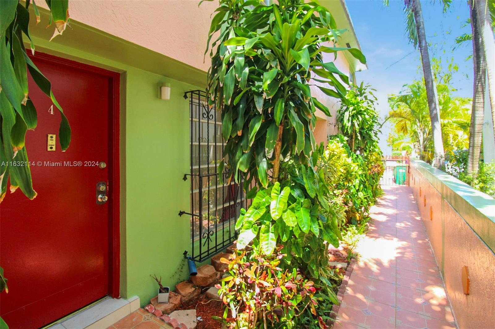 937 Michigan Avenue, Unit 4 Miami Beach, FL 33139 - Photo 3 of 20 a green plant with flowers in front of it