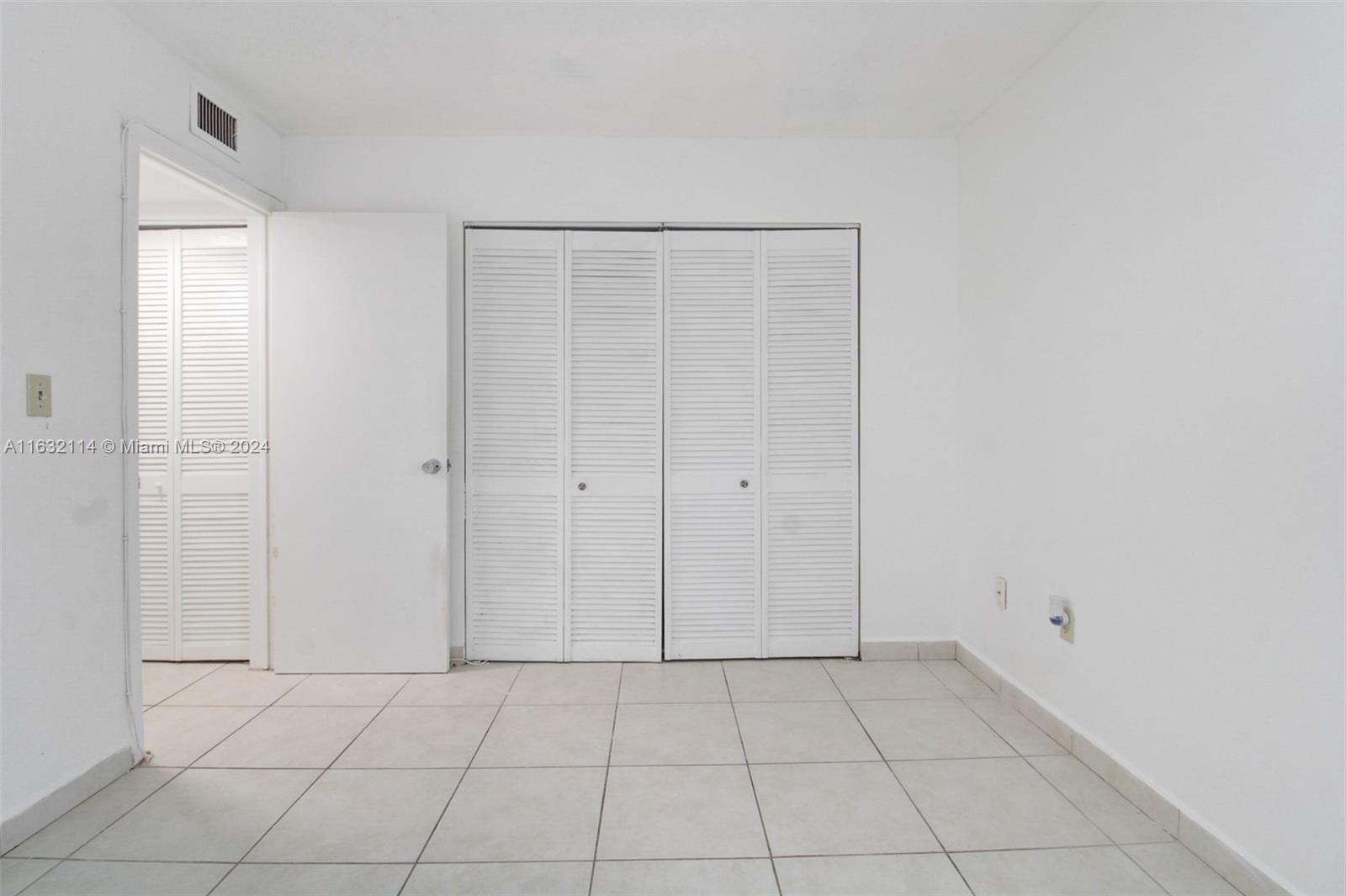 937 Michigan Avenue, Unit 4 Miami Beach, FL 33139 - Photo 9 of 20 a view of an empty room with closet area