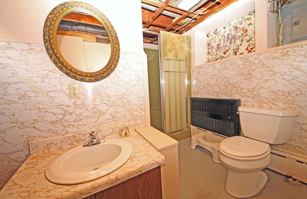 107 Edgemont Road Braintree, MA 02184 - Photo 11 of 15 a bathroom with a sink and a mirror