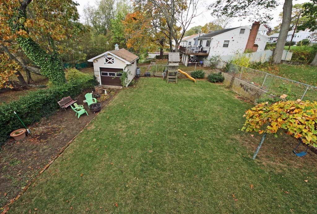 107 Edgemont Road Braintree, MA 02184 - Photo 13 of 15 a front view of a house with garden