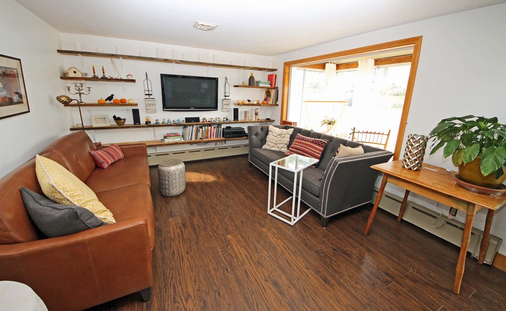 107 Edgemont Road Braintree, MA 02184 - Photo 3 of 15 a living room with furniture and a flat screen tv