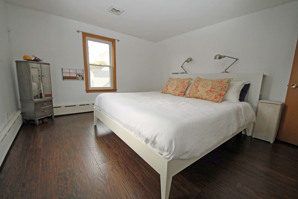 107 Edgemont Road Braintree, MA 02184 - Photo 6 of 15 a large bed sitting in a bedroom next to a window