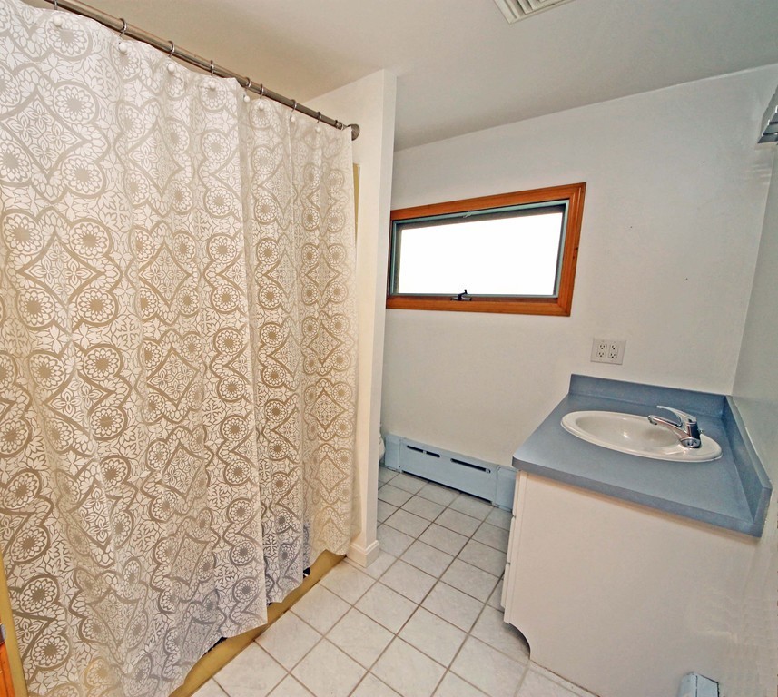 107 Edgemont Road Braintree, MA 02184 - Photo 9 of 15 a bathroom with a sink toilet and shower
