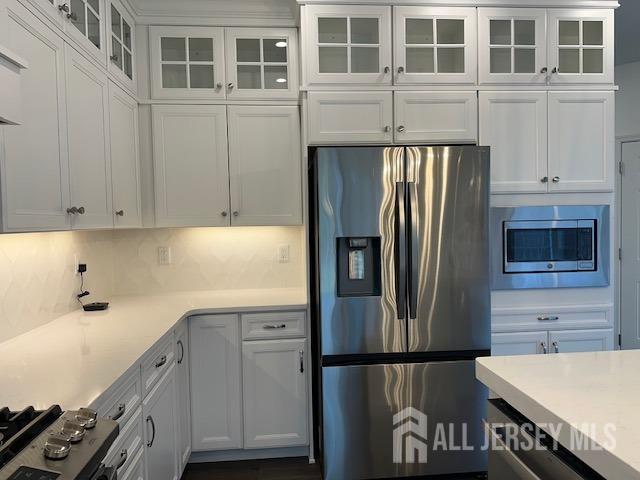 2 Aster Circle Old Bridge, NJ 08857 - Photo 12 of 60 a kitchen with stainless steel appliances granite countertop a refrigerator and a stove top oven