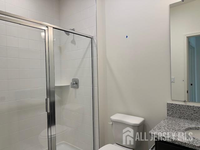 2 Aster Circle Old Bridge, NJ 08857 - Photo 38 of 60 a bathroom with a granite countertop shower and a toilet