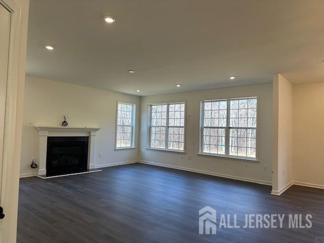 2 Aster Circle Old Bridge, NJ 08857 - Photo 9 of 60 an empty room with wooden floor fireplace and windows