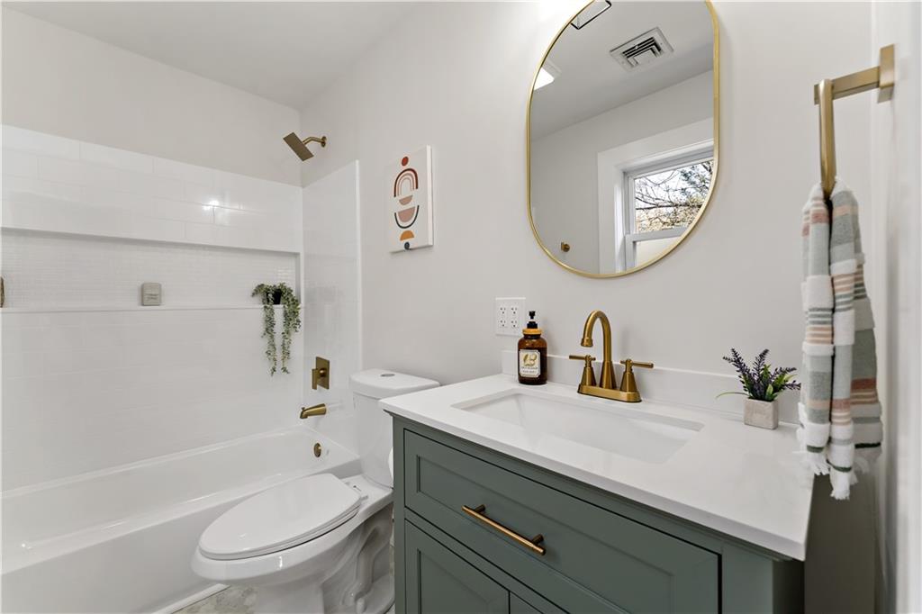 45 Redstone Lane Washington, PA 15301 - Photo 23 of 41 a bathroom with a sink a toilet and a mirror