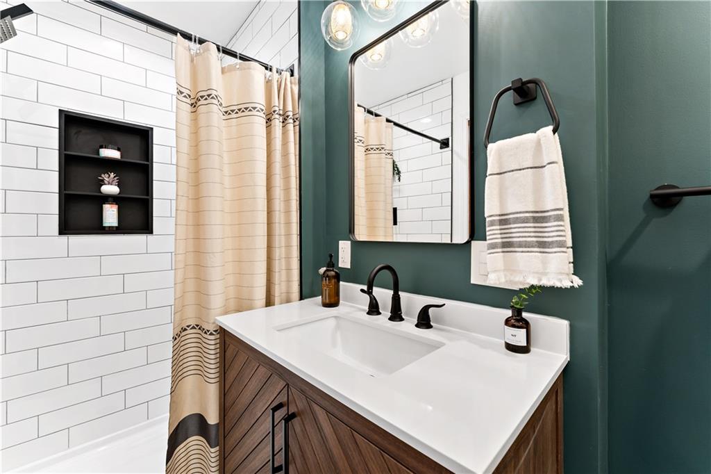 45 Redstone Lane Washington, PA 15301 - Photo 28 of 41 a bathroom with a sink a vanity and a mirror