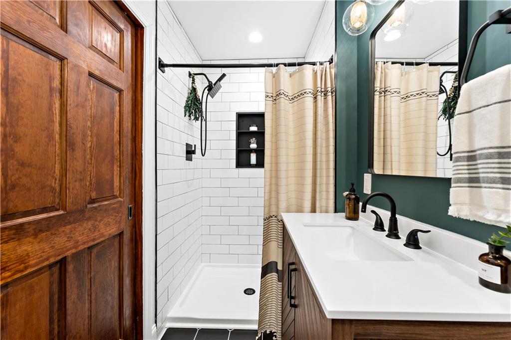 45 Redstone Lane Washington, PA 15301 - Photo 29 of 41 a bathroom with a sink and a mirror