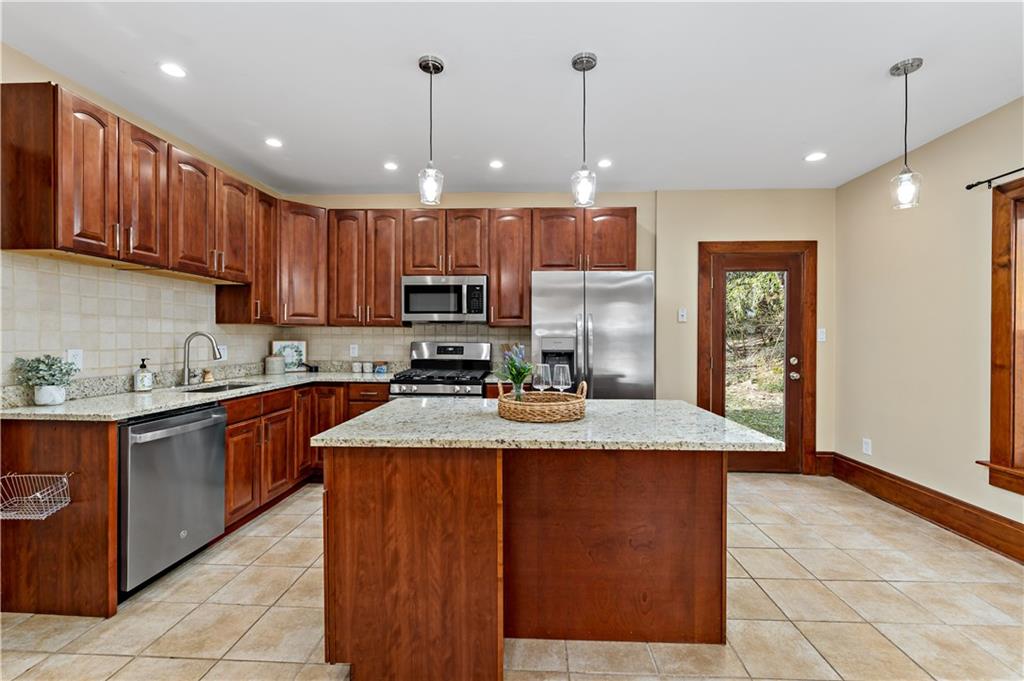 45 Redstone Lane Washington, PA 15301 - Photo 5 of 41 a large kitchen with kitchen island a sink stainless steel appliances and cabinets