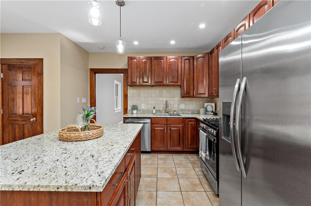 45 Redstone Lane Washington, PA 15301 - Photo 8 of 41 a kitchen with stainless steel appliances granite countertop a sink refrigerator and microwave