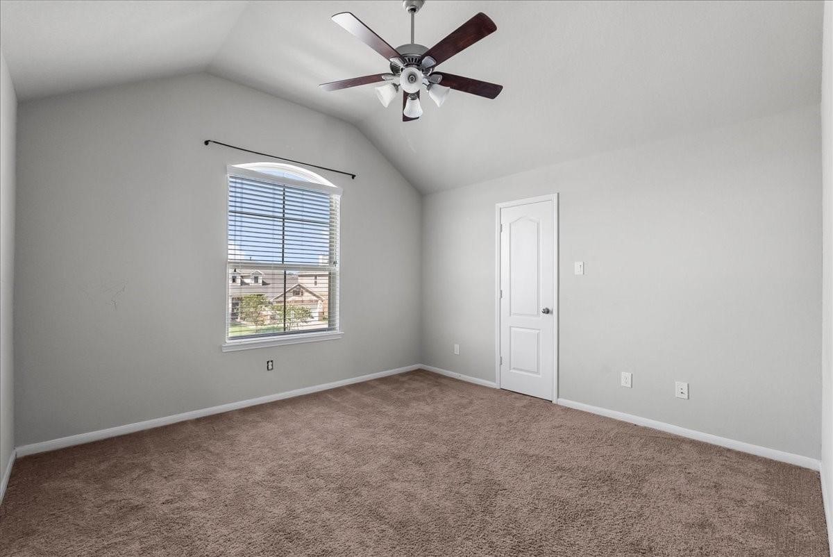 5111 Bay Lane Bacliff, TX 77518 - Photo 26 of 48 an empty room with windows and fan