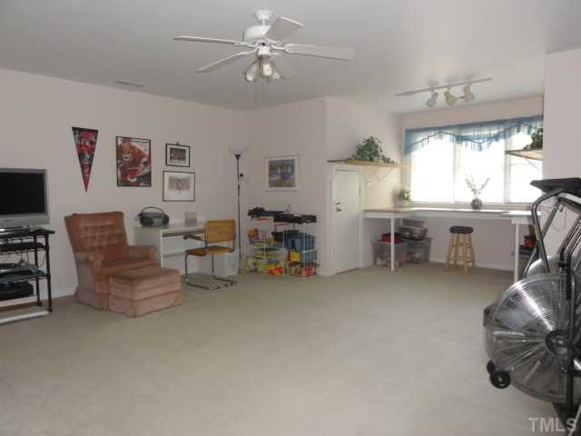 3425 Savan Court Raleigh, NC 27613 - Photo 19 of 25 a living room with furniture and a large window