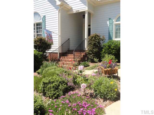 3425 Savan Court Raleigh, NC 27613 - Photo 3 of 25 a potted plant sitting in front of a house