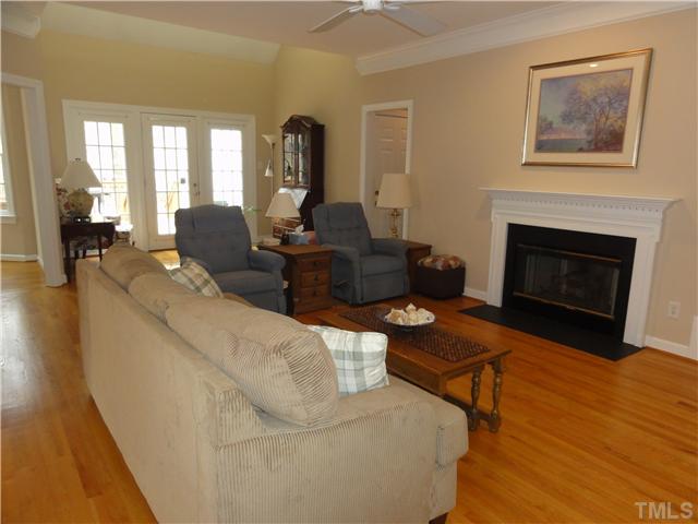 3425 Savan Court Raleigh, NC 27613 - Photo 6 of 25 a living room with furniture and a fireplace