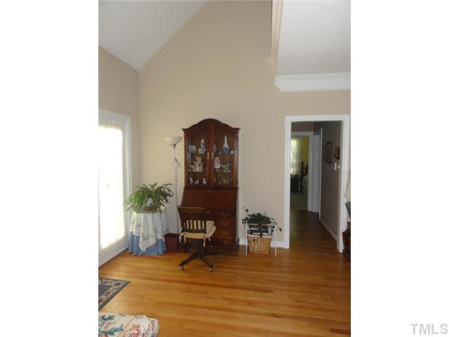 3425 Savan Court Raleigh, NC 27613 - Photo 7 of 25 a living room with furniture and a wooden floor