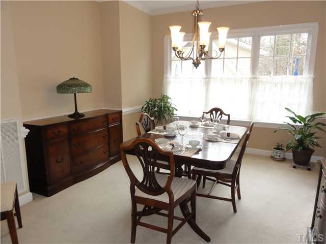 3425 Savan Court Raleigh, NC 27613 - Photo 8 of 25 a view of a dining room with furniture and window