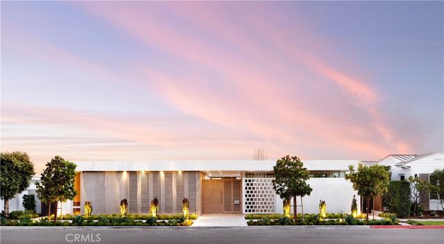 a city street lined with buildings and trees