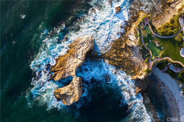 a kitchen with a sink a stove and cabinets