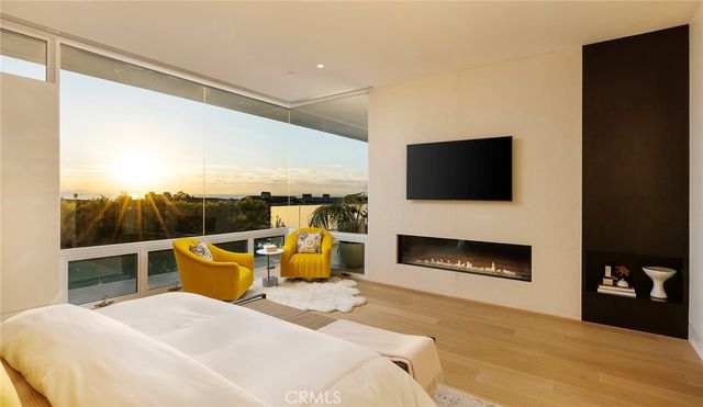a bathroom with a sink a toilet a mirror and shower curtain