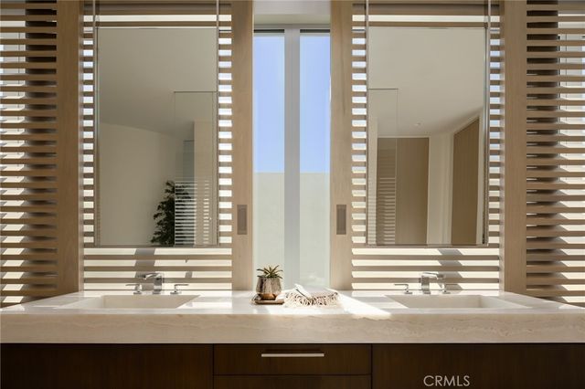 a bedroom with a large bed and a flat screen tv