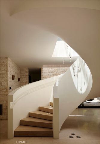 a room with a bed and a mirror