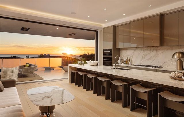 a view of a lake with couches and city view